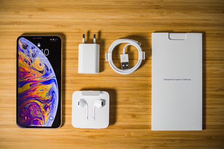 PARIS, FRANCE - OCT 2, 2018: View from above of the new Apple iPhone Xs max with all its box accessories after unboxingのeditorial素材
