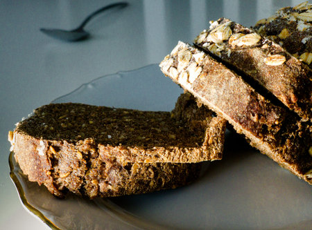 Delicious bread on table - slices on plate made from organic ingredients