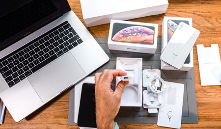 PARIS, FRANCE - SEPTEMBER 21, 2018: Apple fan boy unboxing latest new Apple Iphone Xs Max and Xs...