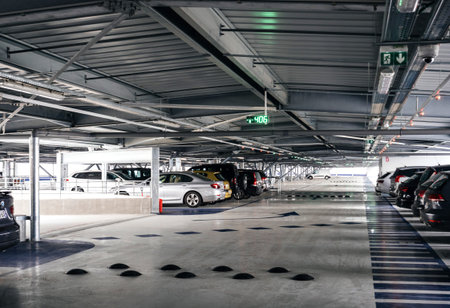 BASEL, SWITZERLAND - MAR 22, 2018: Wide modern parking near central aiport terminal with luxury cars...
