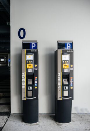 BASEL, SWITZERLAND - MAR 22, 2018: Two Parking teller machines inside EuroAirport -Basel Mulhouse Freiburg airport on the zero levelのeditorial素材