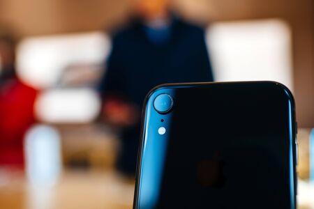 PARIS, FRANCE - OCT 26, 2018: New iPhone XR smartphone in Apple Store Computers during the launch day macro on the detail of rear 12 mp cameraのeditorial素材