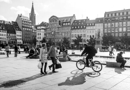 STRASBOURG, FRANCE - OCT 26, 2018: Strasbourg Place Kleber on a warm summer day with hundreds of people tourists and locals walking in the morning couple black and whiteのeditorial素材