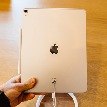 PARIS, FRANCE - NOV 7, 2018: Customer POV personal perspective experiencing new Apple iPad Pro...