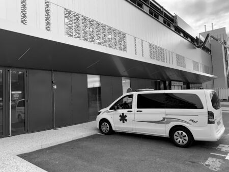 STRASBOURG, FRANCE - OCT 2, 2018: White ambulance van parked in front of hospital Rhena - the new hospital in Strasbourg - black and whiteのeditorial素材