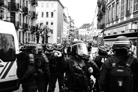 STRASBOURG, FRANCE - DEC 8, 2018: Police officers securing the zone in front of the Yellow vests...