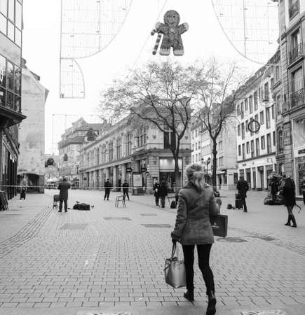 STRASBOURG, FRANCE - DEC 11, 2018: Woman walking toward security zone after the terrorist attack in the Strasbourg Christmas market areaのeditorial素材