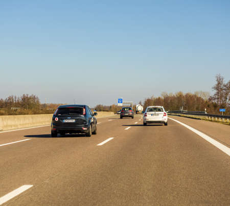 Germany - Feb 25, 2018: cars driving on the winter day on the German Autobahn with the direction Offenburg, Basel, Frankfurtのeditorial素材