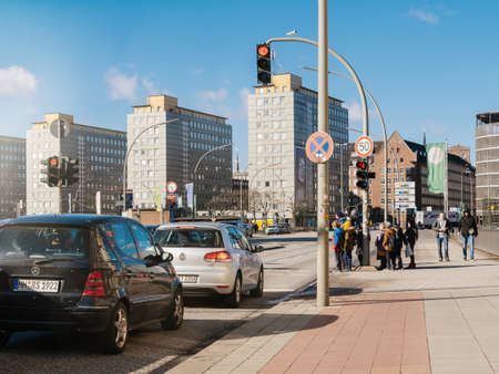 HAMBURG, GERMANY - MAR 20, 2018: Kids waiting to cross the street in central Hamburg - road safety in German cityのeditorial素材