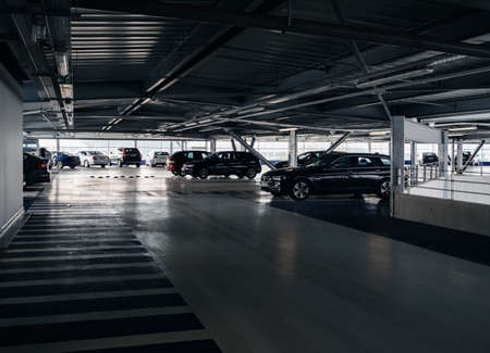BASEL, SWITZERLAND - MAR 22, 2018: Luxury cars parked inside the parking of a modern airport BMW, MErcedes, Volvo, Saabのeditorial素材