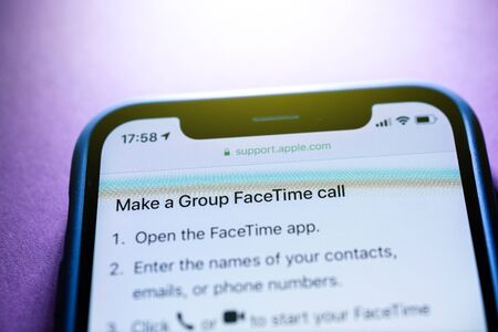Paris, France - Jan 30, 2018: Apple iPhone XS with FaceTime app icon on the display make a group facetime call support on the Apple website - blue technological tonesのeditorial素材