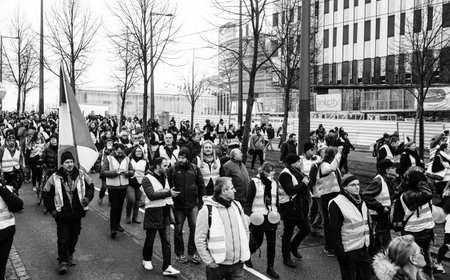 STRASBOURG, FRANCE - FEB 02, 2018: Elevated view of Gilets Jaunes Yellow Vest manifestation on the 12 Saturday of anti-government demonstrations marching on the Boulevard de Dresdeのeditorial素材