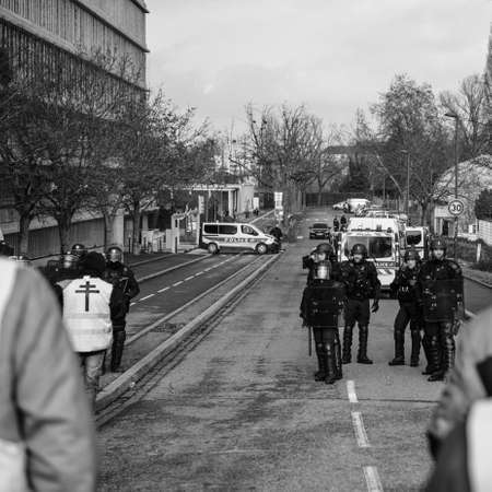 STRASBOURG, FRANCE - FEB 02, 2018: People addresing to armed police squadron during protest of Gilets Jaunes Yellow Vest manifestation on the 12 Saturday of anti-government demonstrationsのeditorial素材