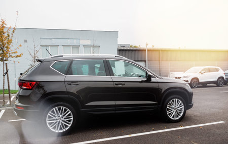 Strasbourg, France - Nov 7 2017: Side view of new Seat Ateca SUV - luxury black painted car at...