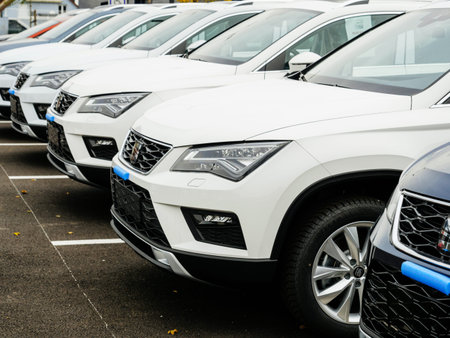 Strasbourg, France - Nov 7 2017: Row of new cars for sale large stock in wide parking lot - Seat car...