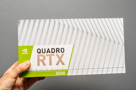 Paris, France - Feb 20, 2019: Man holding cardboard of latest Nvidia Quadro RTX 5000 workstation...