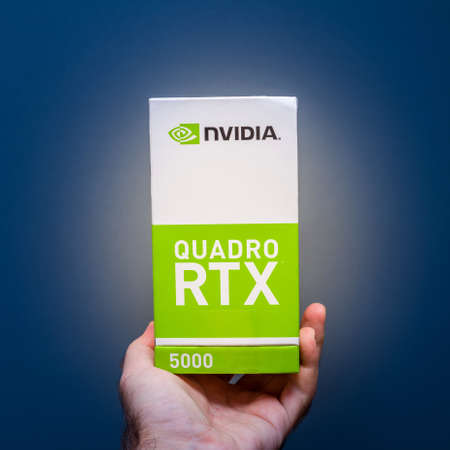 Paris, France - Feb 20, 2019: Man holding cardboard of latest Nvidia Quadro RTX 5000 workstation professional video card GPU for professional CAD CGI scientific machine learning side viewのeditorial素材