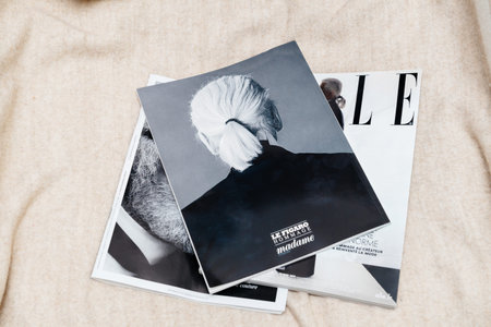 Paris, France - Feb 23, 2019: Multiple French tribute magazine on the wool couch, covering Karl...