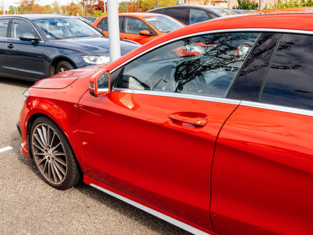 Roppenheim, France - Oct 7, 2017: Left side driver view of luxury Red Mercedes-Benz AMG sport car parked in wide parkingのeditorial素材