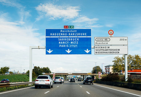 Strasbourg, France - Oct 7, 2017: Driver POV at multiple cars on A4 French highway with destination Reichstett, Hagenau, Karlsruhe, Sarrebruck, Nancy, Paris, Hoenheim Souffelweyersheimのeditorial素材