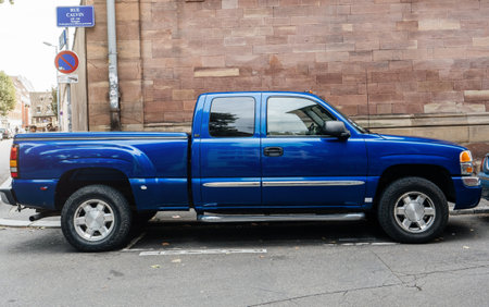 Paris, France - Sep 12, 2017: Side view of huge blue GMC pick-up parked on Rue Calvin street in Strasbourgのeditorial素材