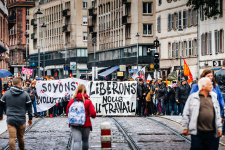 Strasbourg, France - Sep 12, 2017: lets be revolutionary message on placard at political march during a French Nationwide day of protest against the labor reformsのeditorial素材
