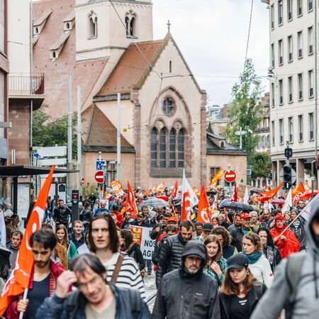 Strasbourg, France - Sep 12, 2017: Crowd with Paroisse Saint-Nicolas church as political march during a French Nationwide day of protest against the labor reform proposedのeditorial素材