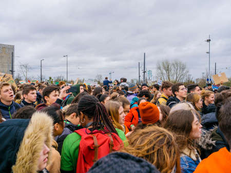STRASBOURG, FRANCE - MAR 15, 2019: Crowd of protesters near European Parliament during demonstrations against climate change global movement Fridays for Future started by Swedish schoolgirlのeditorial素材