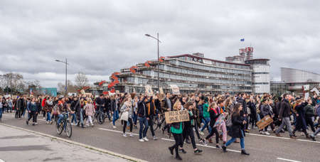 STRASBOURG, FRANCE - MAR 15, 2019: Young kids marching European Court of Human RIghts against climate change global movement Fridays for Future started by Swedish schoolgirl Greta Thunbergのeditorial素材