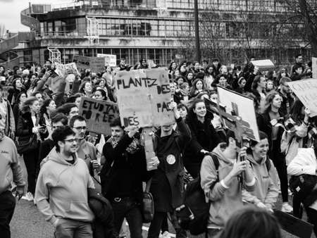 STRASBOURG, FRANCE - MAR 15, 2019: Protesters with placards on closed street at demonstrations against climate change global movement Fridays for Future started by Swedish schoolgirl Greta Thunbergのeditorial素材