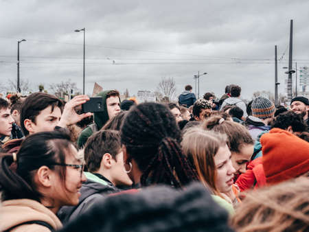 STRASBOURG, FRANCE - MAR 15, 2019: Crowd of protesters near European Parliament during demonstrations against climate change global movement Fridays for Future started by Swedish schoolgirlのeditorial素材