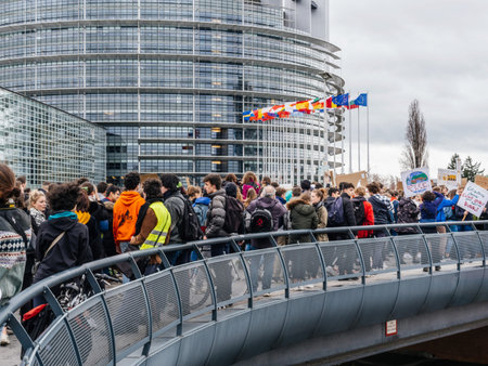 STRASBOURG, FRANCE - MAR 15 2019: Protesters at the bridge near European Parliament during demonstrations against climate change global movement Fridays for Future started by schoolgirl Greta Thunbergのeditorial素材