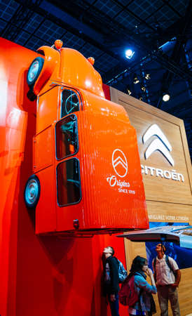 PARIS, FRANCE - OCT 4, 2018: Customers and curious people admiring the Vintage Citroen Origins 2cv fourgonnette van at International car exhibition Mondial Paris Motor Show, model produced by French car makerのeditorial素材