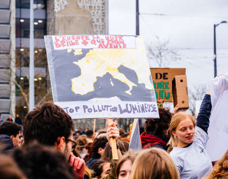 STRASBOURG, FRANCE - MAR 15, 2019: Protesters near European Parliament during demonstrations against climate change global movement Fridays for Future started by Swedish schoolgirl Greta Thunbergのeditorial素材
