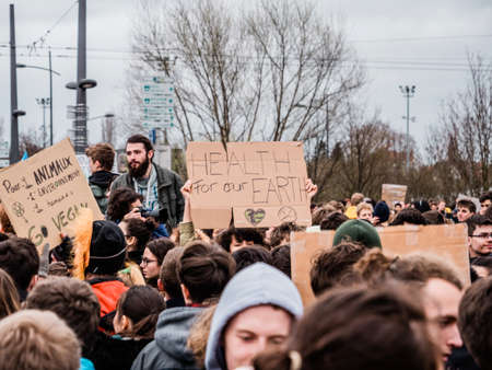 STRASBOURG, FRANCE - MAR 15, 2019: Protesters near European Parliament during demonstrations against climate change global movement Fridays for Future started by Swedish schoolgirl Greta Thunbergのeditorial素材