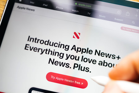 Paris, France - Mar 27, 2019: Apple News Plus demo website on iPad Pro showing introducing Apple...