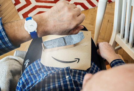 Paris, France - Mar 29, 2019: Senior man unboxing unpacking latest Withings move activity tracking...