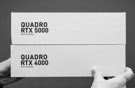 Paris France - Mar 28 2019: Senior man showing latest Nvidia Quadro RTX 4000 5000 workstation GPU...