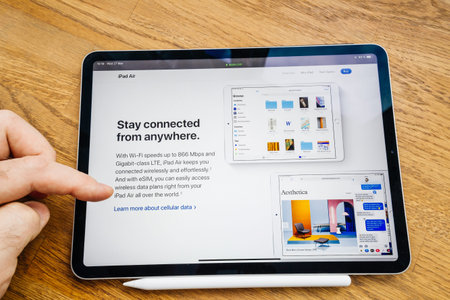 Paris, France Mar 27, 2019: Man hand POV looking at the new iPad Pro featuring Apple Computers...