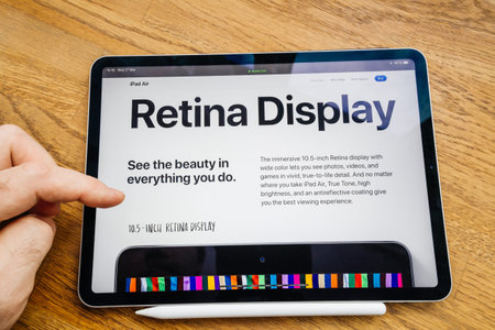Paris, France Mar 27, 2019: Man hand POV looking at the new iPad Pro featuring Apple Computers...