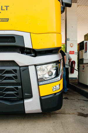 Nice, France - May 7, 2016: Detail of new modern Renault T520 Yellow Truck from the Formula One Sport Team at Total French gas station carrying the fast turbocharged Renault F1 Grand Prixのeditorial素材