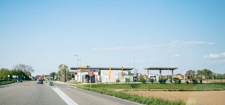 Strasbourg, France - Apr 19, 2019: French Total Access gas station with cars refueling tanks with cheap gas diesel aoutside the city of Strasbourgのeditorial素材