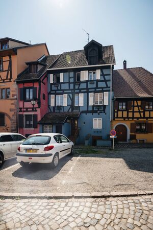 Bergheim, France - 19 Apr 2019: White Peugeot car parked in front of blue half timbered house of Bergheim villageのeditorial素材