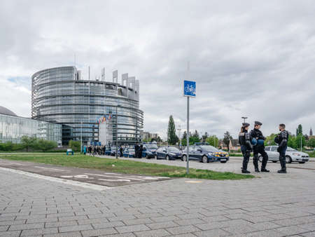 Strasbourg, France - Apr 28, 2019: Police officers securing European Parliament Headquarter from Gilets Jaunes Yellow Vest protesters during another Saturday of anti-government demonstrationsのeditorial素材