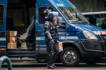 Strasbourg, France - Apr 28, 2019: French Police officer gendarmes distribution to colleagues boxes with 1330-14-548-9477 hand launcher grenades supply for next altercations Yellow vests protestorsのeditorial素材