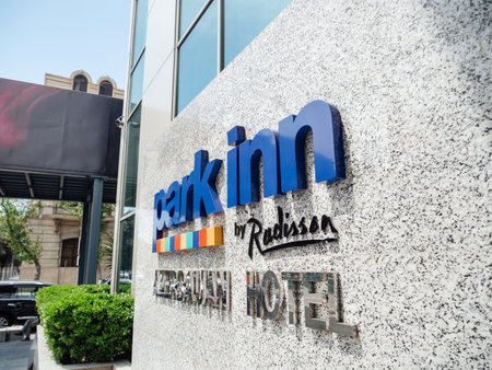 Baku, Azerbaijan - May 2, 2019: Park Inn By Radisson Baku Hotel sign on the facade in central Baku on a warm summer dayのeditorial素材