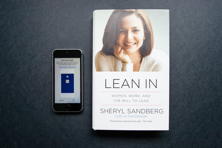 Paris, France - Feb 17, 2017: Lean in book by Sheryl Sandberg COO of Facebook isolated on gray...