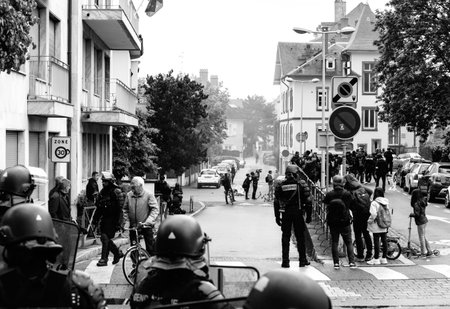 Strasbourg, France - Apr 28, 2019: Rear view of French police officers and journalists reporting the...