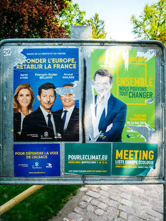 Strasbourg, France - May 23, 2019: Posters in green sunny park for 2019 European Parliament election featuring French politiciains from Les Republicains and Ecologist partyのeditorial素材