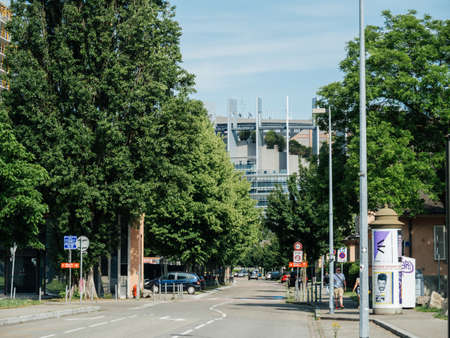 Strasbourg, France - May 26, 2019: European Parliament headquarter as seen from Allee du Printemps street with tall trees and parked cars and pedestrians walking on Freench streetのeditorial素材